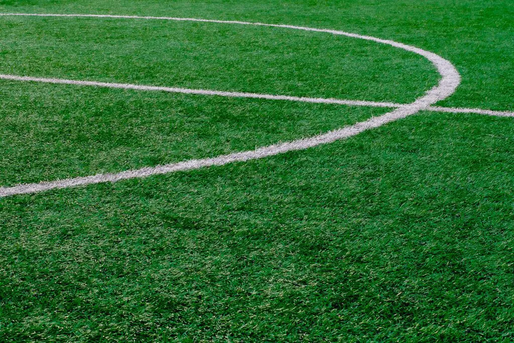 Artificial turf soccer field with center marker line (stock)