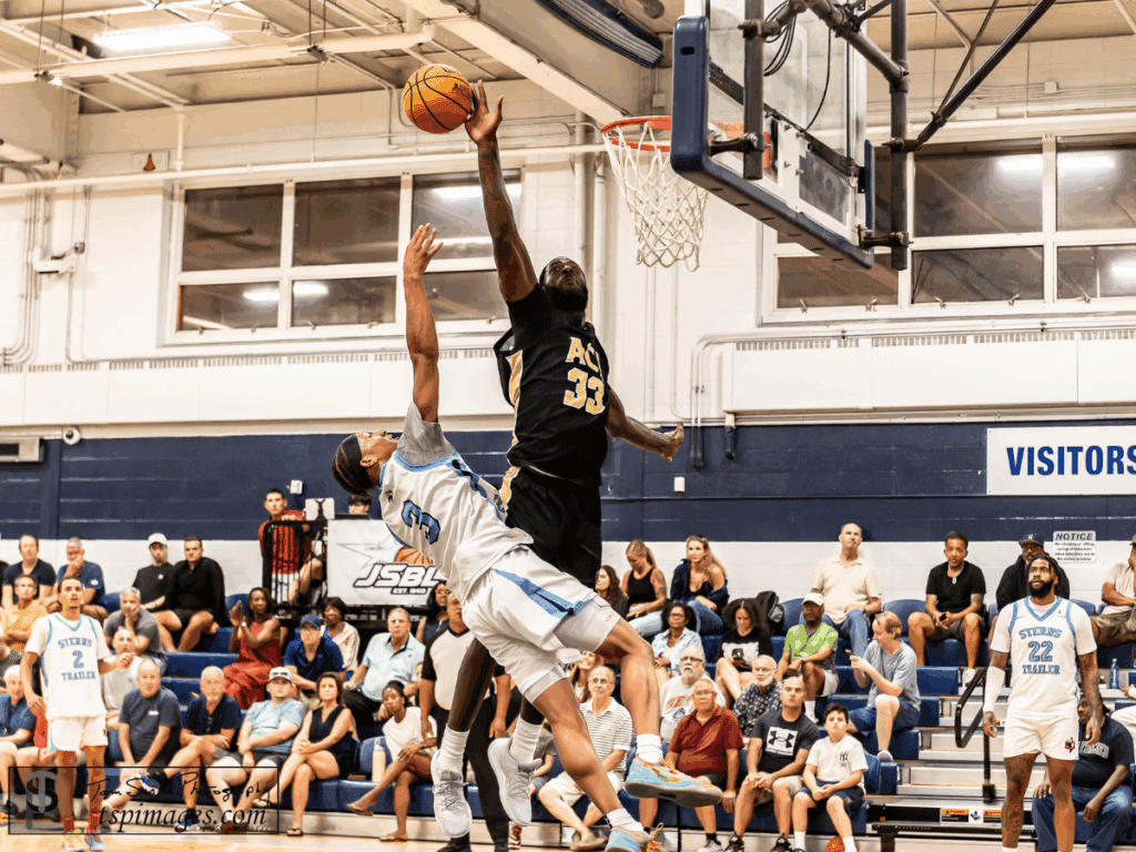 Jared Kimbrough blocks regular season MVP Jakari Spence's shot (Photo by Tom Smith)
