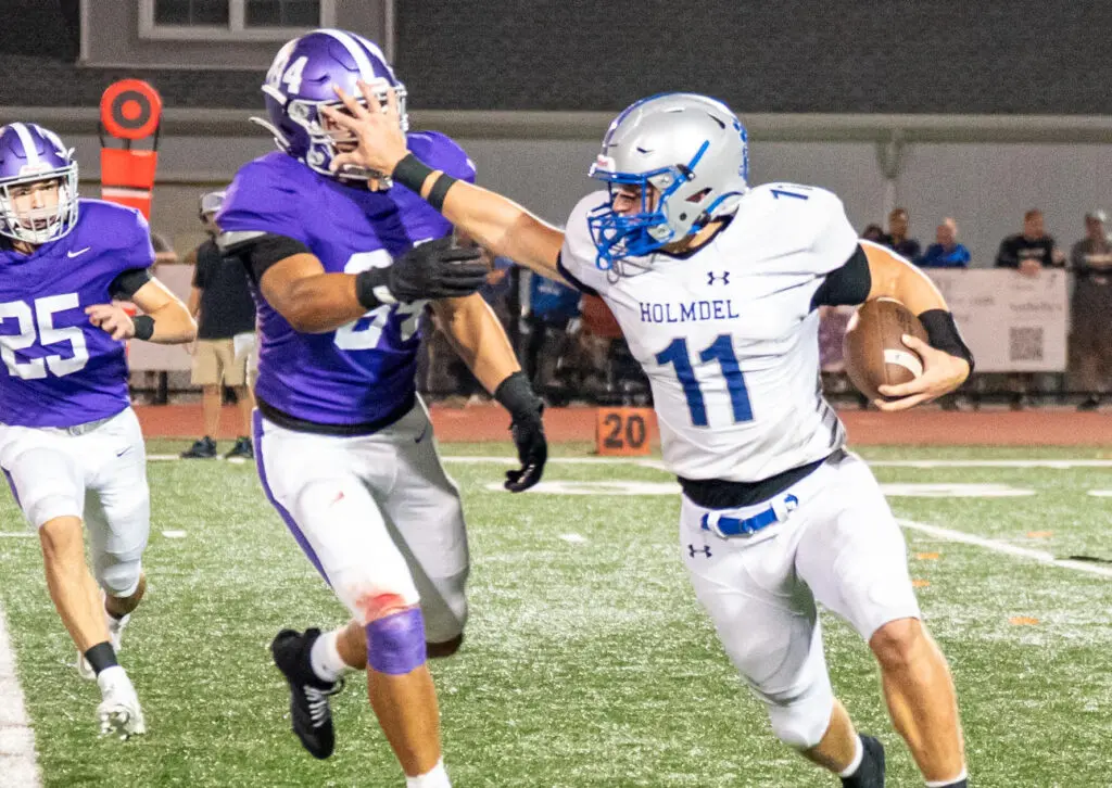 Holmdel's Jack Cannon holds off a Rumson defender