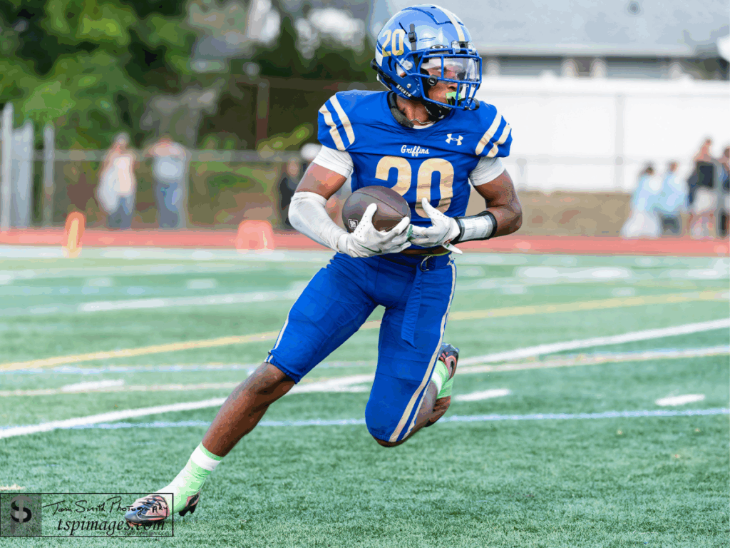 Donovan Catholic's Alex Staten runs the ball in a game earlier this season (Photo by Tom Smith/tspimages.com)