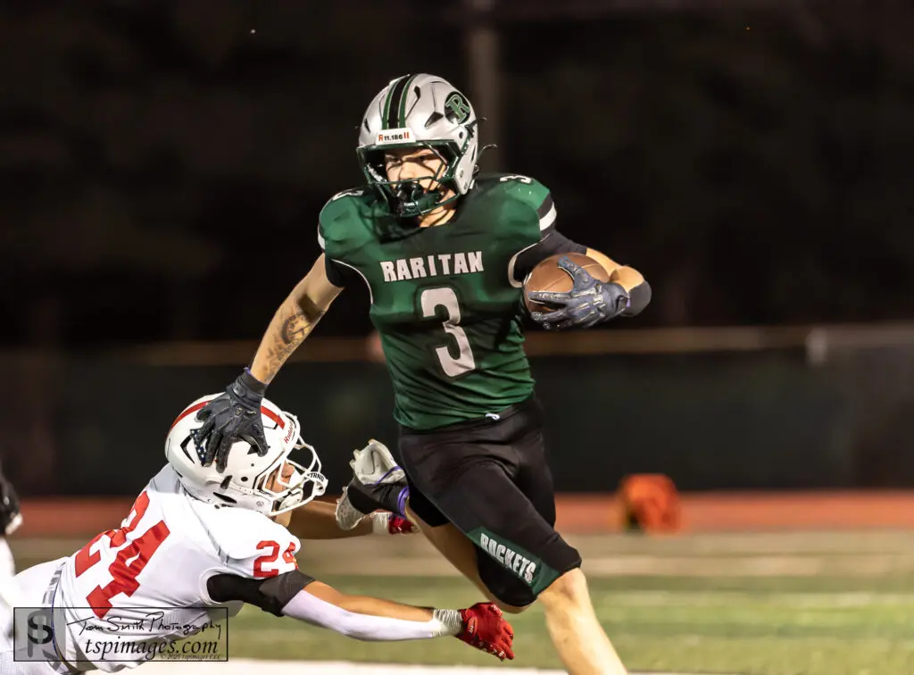 Raritan's Eric Berg runs with the ball
