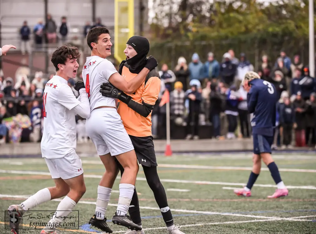 From left, Tanner Griffin, Paul Fury and Kellen Clauburg celebrate Wall's penalty-kick win over Manasquan Tuesday in the NJSIAA Central Jersey Group II semifinals. (Photo: Tom Smith | tspsportsimages.com)