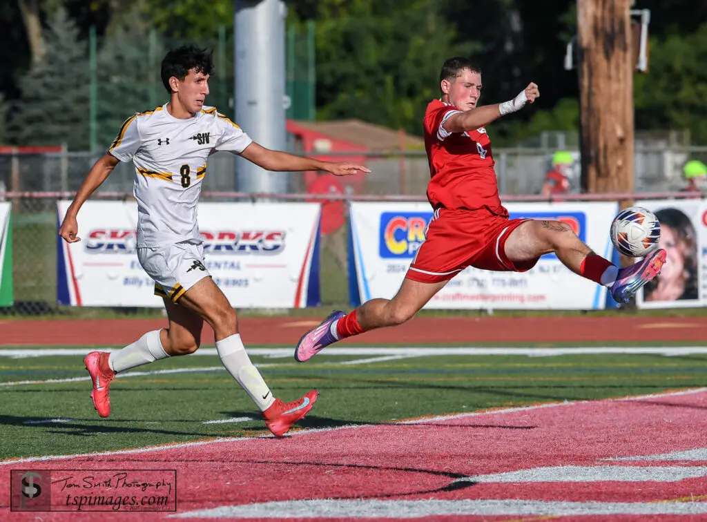 Ocean junior Connor Shaw (right) chased by by St. John Vianney senior Dominick Fuoco. (Photo: Tom Smith | tspsportsimages.com)