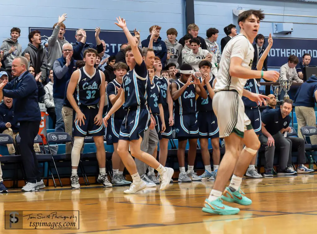 CBA senior Charlie Marcoullier celebrates hitting his go-ahead three-pointer in overtime vs. Red Bank Catholic. (Photo: Tom Smith | tspsportsimages.com)