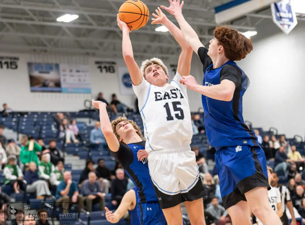 Toms River East sophomore Tommy Intintola puts up a shot between Donovan Catholic freshman Ethan Sulkowski (left) and senior Pat Gallo (right) during the Kevin Williams Christmas Classic. (Photo: Tom Smith | tspsportsimages.com)